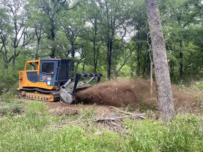 Mulching heavy underbrush through wooded acreage